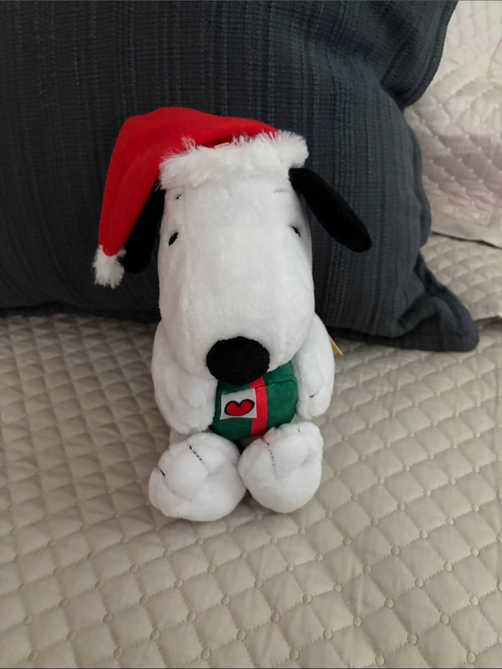 Peanuts Snoopy Plush Holiday Musical and Moving Toy with Red Santa Hat
